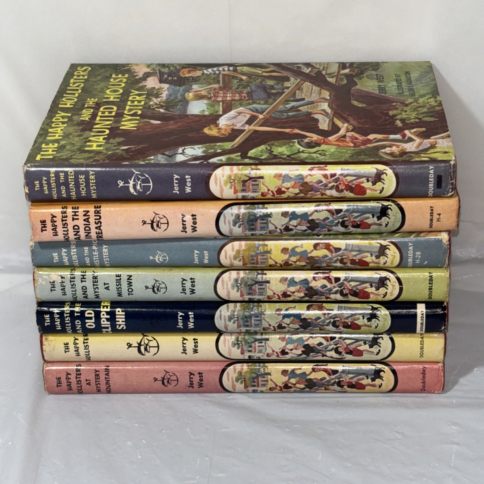 Lot 7 Vintage THE HAPPY HOLLISTERS Book Series by Jerry West HC w/Dust Jackets