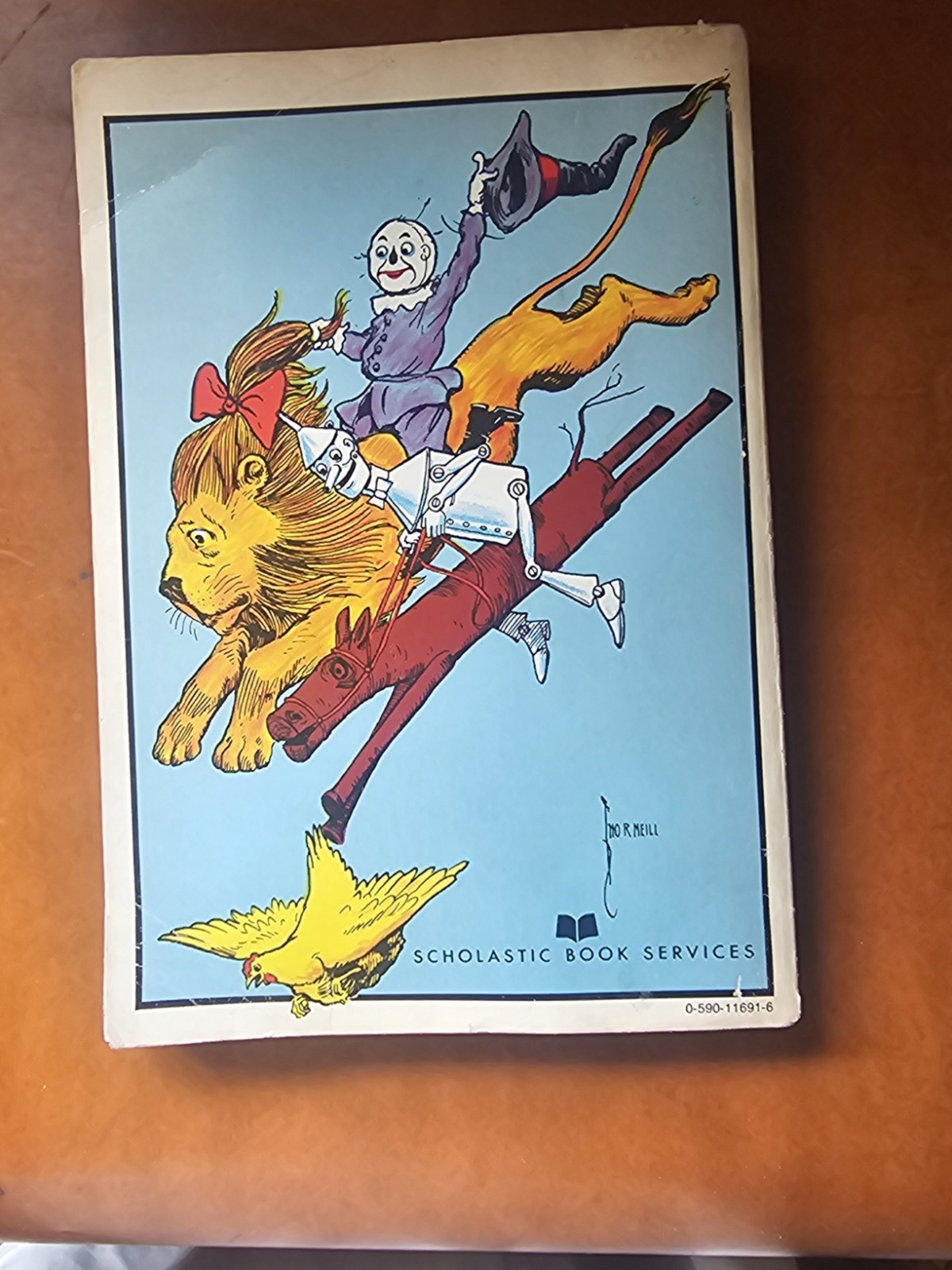 vintage paperback edition of Ozma of Oz by L. Frank Baum, featuring…