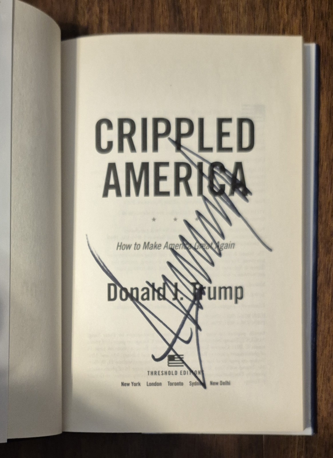 PRESIDENT DONALD TRUMP SIGNED AUTOGRAPHED “CRIPPLED AMERICA” HARDCOVER BOOK